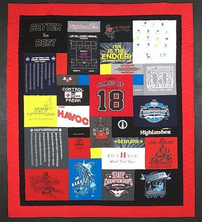 Graduation T-shirt quilt with a black and red border. T-shirt quilt with a border by Too Cool T-shirt Quilts