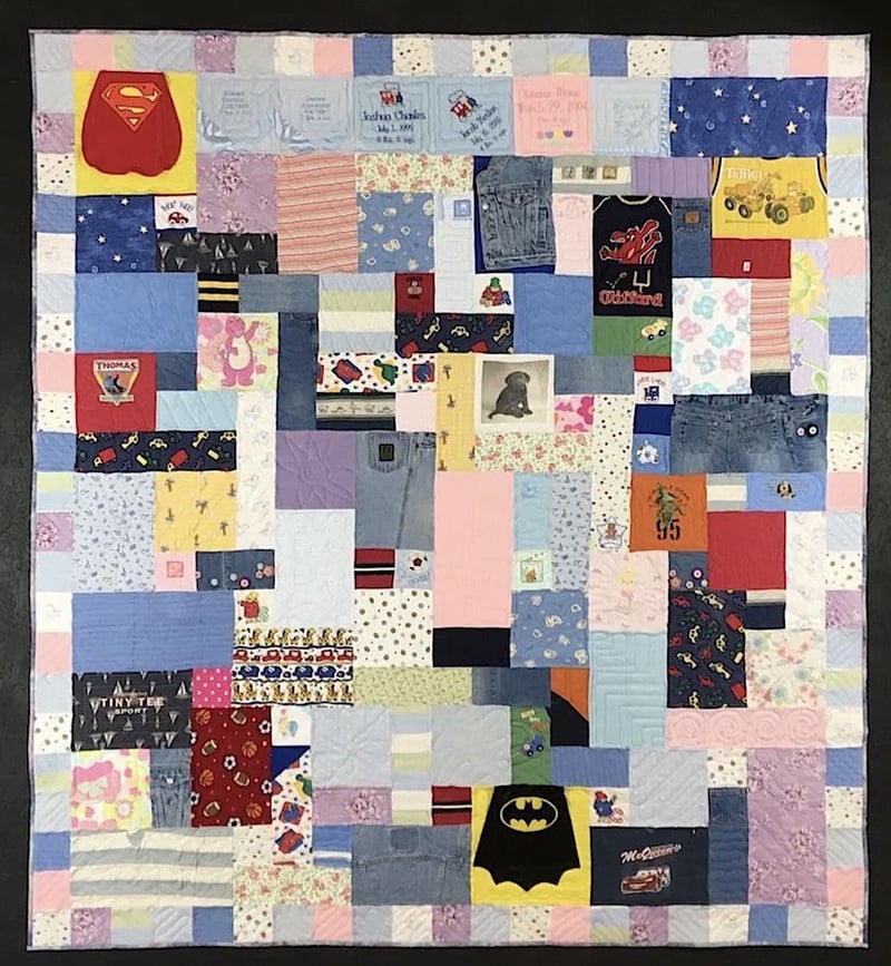 Baby quilt with border by Too Cool T-shirt Quilts