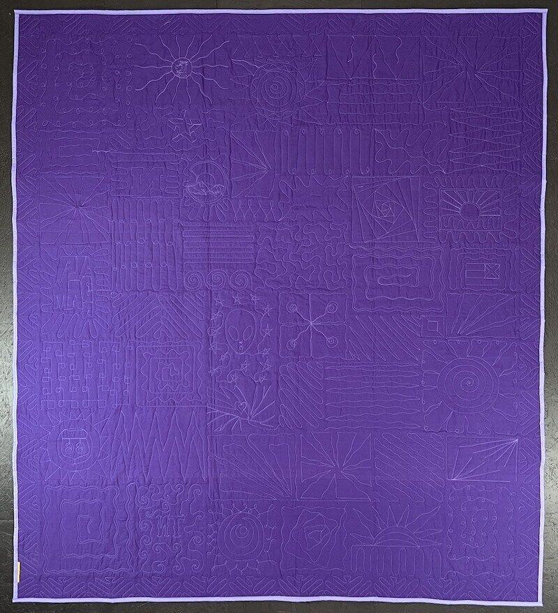 Back of purple quilton the back of a Too Cool T-shirt Quilt
