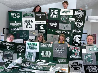 Gang with 8 MSU quilts from Too Cool T-shirt Quilts