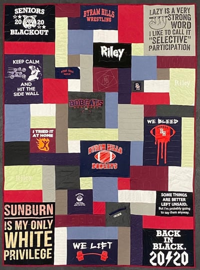 T-shirt quilt made larger by adding blocks of blank clothing by Too Cool T-shirt Quilts