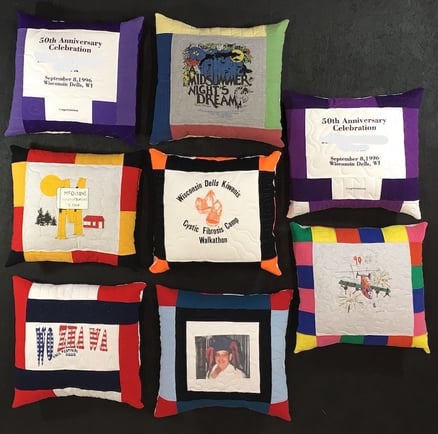 A group of 8 memorial pillows made from T-shirts. Memorial Quilt made from clothing by Too Cool T-shirt Quilts