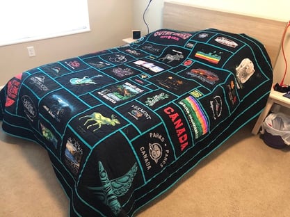 Travel quilt on a bed Too Cool T-shirt Quilts