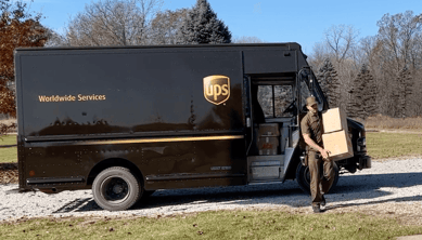 UPS guy bringing T-shirts to  Too Cool T-shirt Quilt