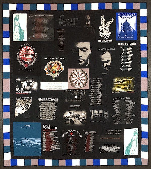 all black band concert T-shirt quilt with a few colored blocks, by Too Cool T-shirt Quilts