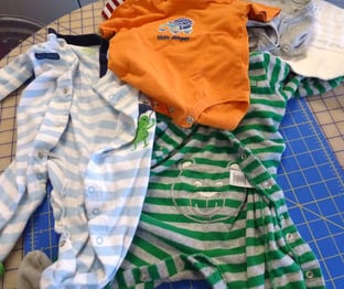 baby clothes ready to cut for a quilt