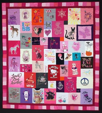 A little girl T-shirt quilt with a pink borderT-shirt quilt with a border by Too Cool T-shirt Quilts