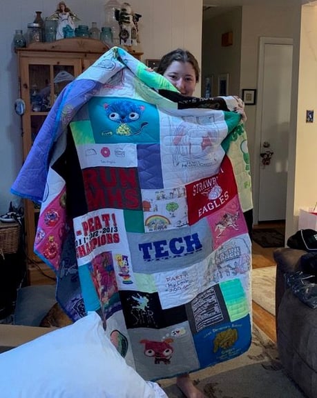 Someone has to love their T-shirt Quilt to recommend their maker to someone else