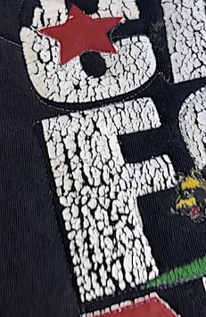 pealing flaking letters on a T-shirt - it can be used on a quilt