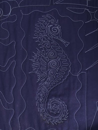 seahorse tracking back to front on the back of a Too Cool T-shirt Quilt