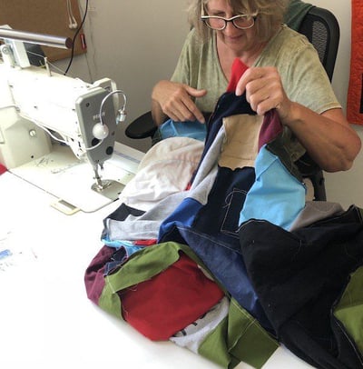 sewing a quilt at Too Cool T-shirt Quilts